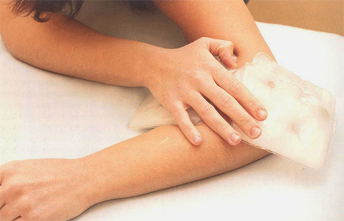 A cold compress will slow the spread of the poison through the tissues.